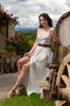 Feminine and legs-emphasizing summer dress made from organic GOTS-certified linen. Featuring a charming grey stripe pattern and delicate mother-of-pearl buttons. Perfect cottagecore style. Italian summer.