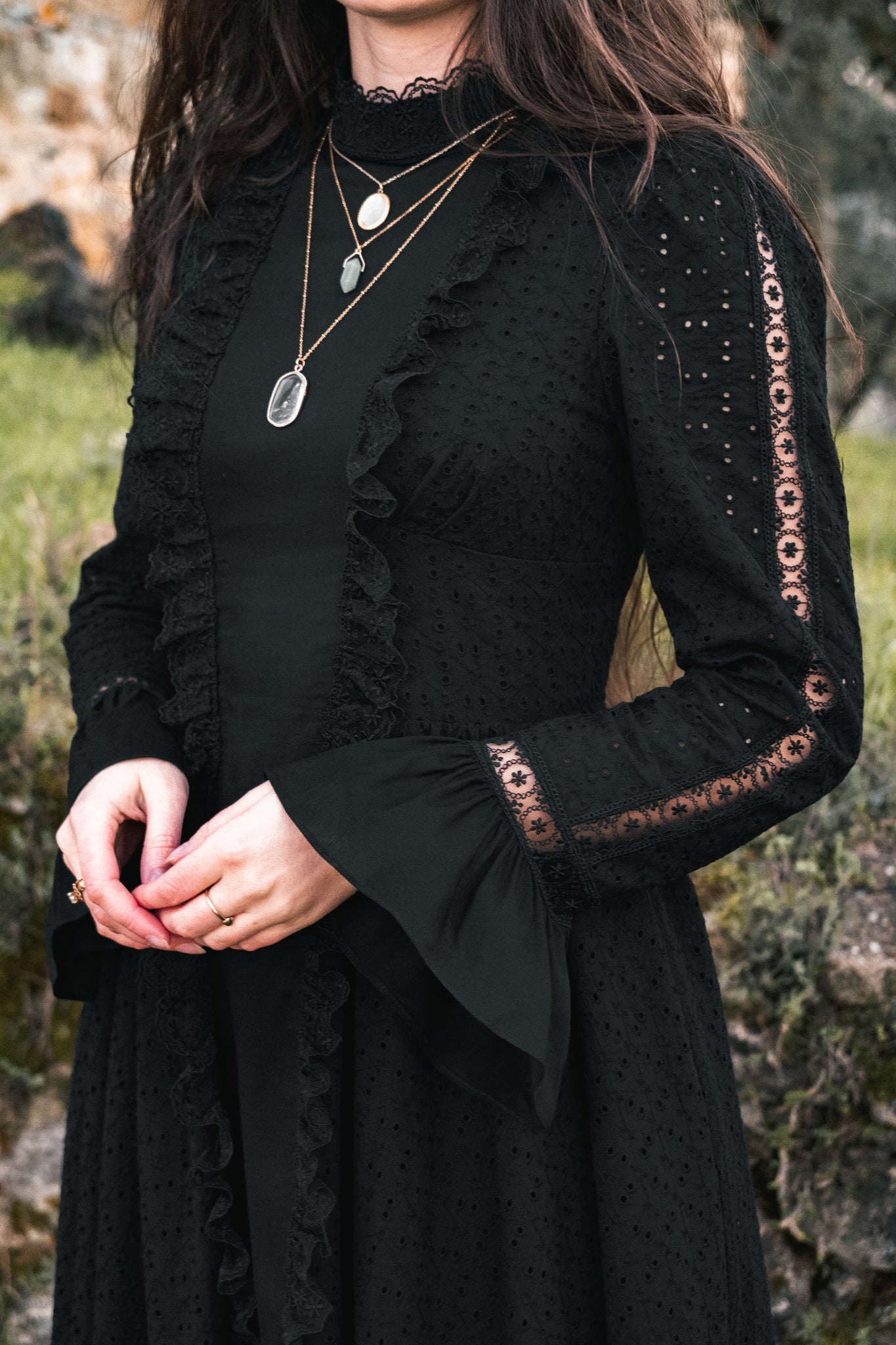 details of black dress, bell sleeves and lace 