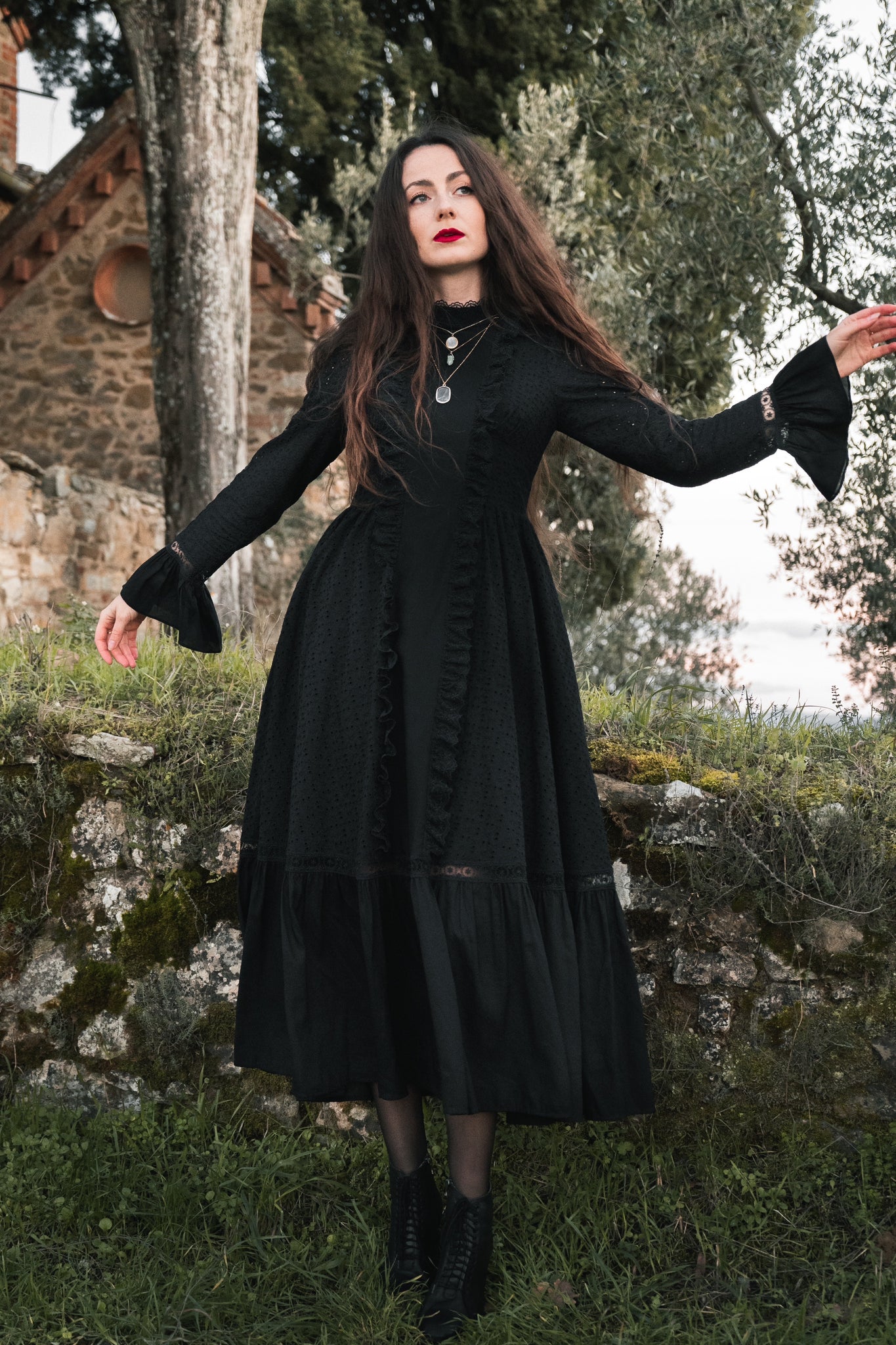 dark witchy boho dress on a girl in the woods 