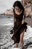 Side view of the Andalusia dark brown linen dress with sweetheart bodice and side pockets