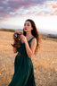 Close-up of the Andalusia emerald green linen dress showing the sweetheart neckline and fitted waist