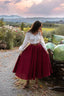 Back view of the Ellie burgundy linen midi skirt showing its full softly flared silhouette