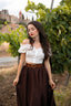 Front view of the Ellie dark brown linen midi skirt showing the high waist and flared shape