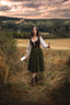 Full-length countryside look with the Estella dark brown linen corset, white blouse and moss green skirt
