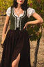 Three-quarter close-up of the Estella moss green linen corset with floral trim and adjustable lacing