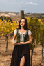 Full-length vineyard look with the Estella moss green linen corset, white blouse and dark maxi skirt
