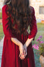 Close back view of the Siena burgundy linen dress showing the defined waist and softly flared skirt