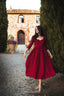 Siena burgundy linen midi dress in motion showing the softly flared A-line skirt
