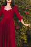 Siena burgundy linen dress showing the sweetheart neckline, fitted bodice and three-quarter sleeves