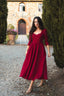Front view of the Siena burgundy linen midi dress with a sweetheart neckline and flared skirt